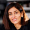 Nikta Fakhri in the lab, with petri dishes in foreground.