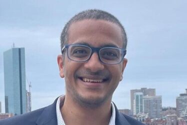 Mohamed Abdelhafez poses with two awards